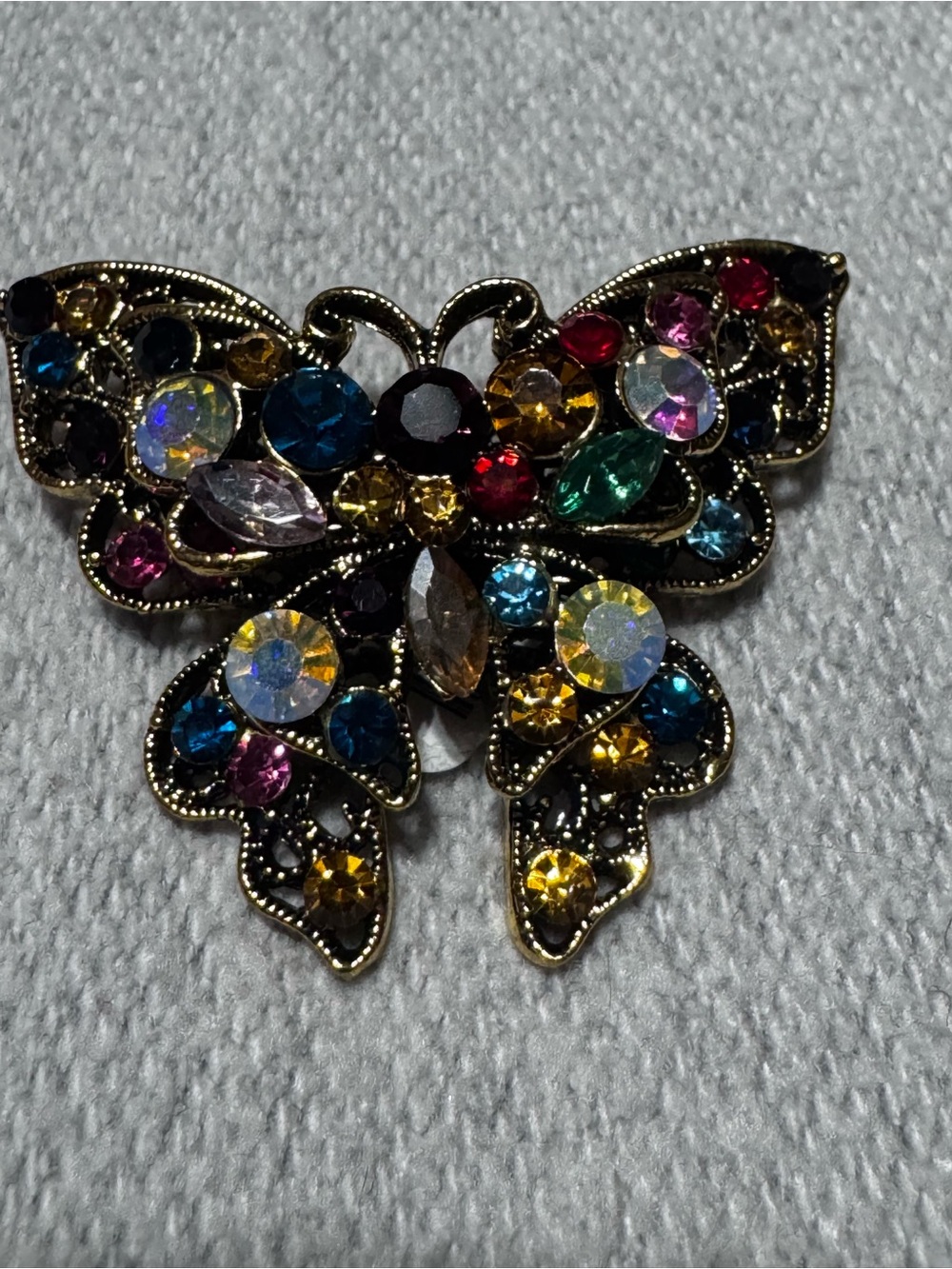 Stanley Multicolor Crystal Butterfly Brooch in Gold Tone